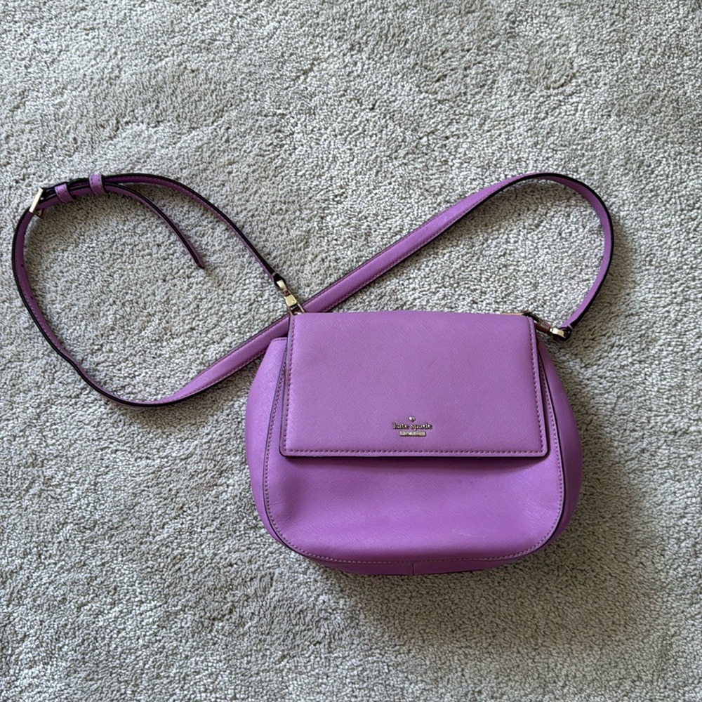 Used Purple Authentic Kate Spade Bag. Please see pictures of wear.